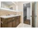 Bathroom featuring double vanity, large mirror, and access to additional rooms at 2429 Sherbrooke Ne Ct, Atlanta, GA 30345