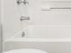 Close-up of a clean, well-maintained white bathtub with chrome fixtures in a tiled bathroom at 2429 Sherbrooke Ne Ct, Atlanta, GA 30345