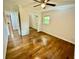Bedroom featuring hardwood floors, a ceiling fan, and view of the backyard at 2429 Sherbrooke Ne Ct, Atlanta, GA 30345