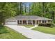 Charming one-story brick home with a well-manicured lawn and two-car garage at 2429 Sherbrooke Ne Ct, Atlanta, GA 30345