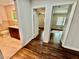 Hallway view showing access to a bathroom and bedroom with hardwood floors at 2429 Sherbrooke Ne Ct, Atlanta, GA 30345