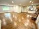 Open-concept living room with hardwood floors, fireplace, and large windows providing natural light at 2429 Sherbrooke Ne Ct, Atlanta, GA 30345
