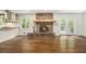 Spacious living room with a fireplace, hardwood floors, and access to the backyard at 2429 Sherbrooke Ne Ct, Atlanta, GA 30345