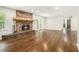 Bright living room with hardwood floors and brick fireplace with stone accents at 2429 Sherbrooke Ne Ct, Atlanta, GA 30345