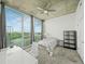 Bright bedroom with large windows, a ceiling fan, carpet flooring, and a minimalist aesthetic at 361 17Th Nw St # 1222, Atlanta, GA 30363
