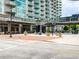 Modern building exterior with retail space, attractive landscaping, and well-maintained sidewalks at 361 17Th Nw St # 1222, Atlanta, GA 30363
