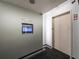 Modern hallway with elevator access and digital display; blending convenience and technology at 361 17Th Nw St # 1222, Atlanta, GA 30363