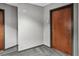 Condo hallway with apartment number and wood apartment door at 361 17Th Nw St # 1222, Atlanta, GA 30363