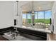 Open kitchen featuring black backsplash, granite countertops, and large windows at 361 17Th Nw St # 1222, Atlanta, GA 30363