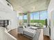 Bright living room with hardwood floors, large windows, and comfortable seating arrangement at 361 17Th Nw St # 1222, Atlanta, GA 30363