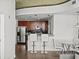 Modern kitchen and bar seating area blending into a cozy living space at 361 17Th Nw St # 1222, Atlanta, GA 30363