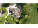 Aerial view of a stately home with a pool, basketball court, and lush landscaping at 5625 Buckleigh Pointe, Suwanee, GA 30024
