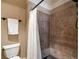 Modern bathroom featuring a tiled shower with a glass door and neutral wall color scheme and a towel rack at 5625 Buckleigh Pointe, Suwanee, GA 30024