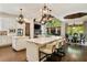 Spacious kitchen with two islands, stainless steel appliances, and an adjacent breakfast nook at 5625 Buckleigh Pointe, Suwanee, GA 30024