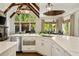 Modern kitchen featuring white countertops, stainless steel appliances, and stylish finishes at 5625 Buckleigh Pointe, Suwanee, GA 30024