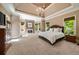 Spacious main bedroom features a fireplace, tray ceilings, and plenty of natural light at 5625 Buckleigh Pointe, Suwanee, GA 30024