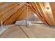 Spacious unfinished attic, offering ample storage with exposed beams and wooden flooring at 239 Trail Nw Rd, Marietta, GA 30064