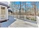 A covered back deck made of wood offers a calming view into the scenic wooded area at 239 Trail Nw Rd, Marietta, GA 30064