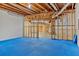 Unfinished basement with blue foam flooring partially installed in the space at 239 Trail Nw Rd, Marietta, GA 30064