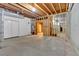 Unfinished basement space, ready for customization with exposed ceiling beams and concrete floor at 239 Trail Nw Rd, Marietta, GA 30064