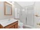 Bathroom featuring a vanity, toilet, and tiled glass shower with updated fixtures at 239 Trail Nw Rd, Marietta, GA 30064