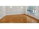An empty dining room with hardwood floors and a picture window with natural light at 239 Trail Nw Rd, Marietta, GA 30064