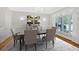 Formal dining room features wainscoting, neutral colors, and picture window at 239 Trail Nw Rd, Marietta, GA 30064