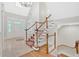 Spacious foyer with tile flooring, staircase, and leaded glass accent windows at 239 Trail Nw Rd, Marietta, GA 30064