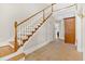 Foyer with hardwood stairs and tile flooring leading to an upper level with open landing and natural light at 239 Trail Nw Rd, Marietta, GA 30064