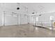 Spacious three-car garage with ample lighting, and smooth concrete floors at 239 Trail Nw Rd, Marietta, GA 30064
