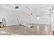Well-lit three-car garage with concrete floors, offering ramp access and ample space at 239 Trail Nw Rd, Marietta, GA 30064