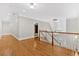 Hallway with hardwood floors, white trim, and natural light from the window at 239 Trail Nw Rd, Marietta, GA 30064