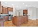 Kitchen features include custom cabinetry, granite countertops, and stainless steel appliances at 239 Trail Nw Rd, Marietta, GA 30064