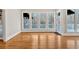 Bright living room features a wall of windows offering scenic views and natural light at 239 Trail Nw Rd, Marietta, GA 30064