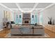 Bright living room with hardwood floors, a stone fireplace, and french doors at 239 Trail Nw Rd, Marietta, GA 30064
