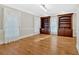 Elegant living room featuring hardwood floors, built-in bookcases, and abundant natural light at 239 Trail Nw Rd, Marietta, GA 30064