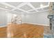 Open living space featuring hardwood floors and a coffered ceiling at 239 Trail Nw Rd, Marietta, GA 30064