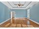 Expansive bedroom featuring hardwood floors, tray ceilings, and inviting atmosphere at 239 Trail Nw Rd, Marietta, GA 30064
