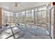 A screened porch features stone flooring and panoramic views of the wooded scenery at 239 Trail Nw Rd, Marietta, GA 30064