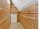 Spacious walk-in closet with cedar plank walls and a customizable shelving system, offering ample storage at 239 Trail Nw Rd, Marietta, GA 30064
