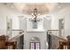 Elegant foyer with wood staircase, wrought iron railing, chandelier, and views to the front door at 2480 Flint Creek Dr, Cumming, GA 30041