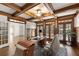 Well-appointed office space with coffered ceilings, natural light, and custom desk at 2480 Flint Creek Dr, Cumming, GA 30041