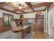 Home office with built-in shelves, a fireplace, and natural light at 2480 Flint Creek Dr, Cumming, GA 30041