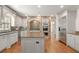 Gourmet kitchen with granite countertops, a large island, stainless steel appliances, and a decorative backsplash at 2480 Flint Creek Dr, Cumming, GA 30041