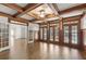 Spacious living room with coffered ceilings, French doors, and natural light at 2480 Flint Creek Dr, Cumming, GA 30041
