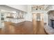 Bright living room with soaring ceilings, stone fireplace, hardwood floors, and open to the kitchen at 2480 Flint Creek Dr, Cumming, GA 30041