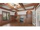 Cozy living room with coffered ceilings, fireplace, and built-in shelving at 2480 Flint Creek Dr, Cumming, GA 30041