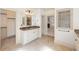 Spacious main bathroom with dual walk in closets, large vanity, and tile floors at 2480 Flint Creek Dr, Cumming, GA 30041