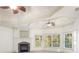 Bright main bedroom boasts a fireplace and large windows with wooded views at 2480 Flint Creek Dr, Cumming, GA 30041
