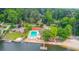Aerial view showcasing the community pool, playground, tennis court, lake, and well-maintained surroundings at 2981 Cardinal Lake Dr, Duluth, GA 30096